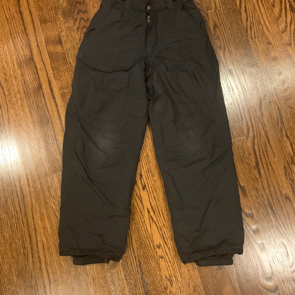 Boys snow pants with adjustable waist. Tapered leg , side pockets